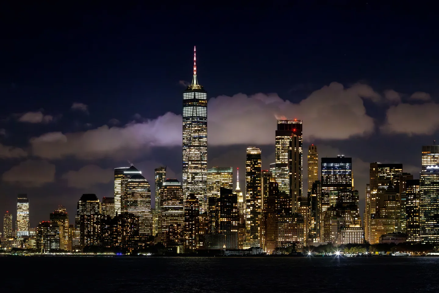 Lower Manhattan skyline illuminated at dusk